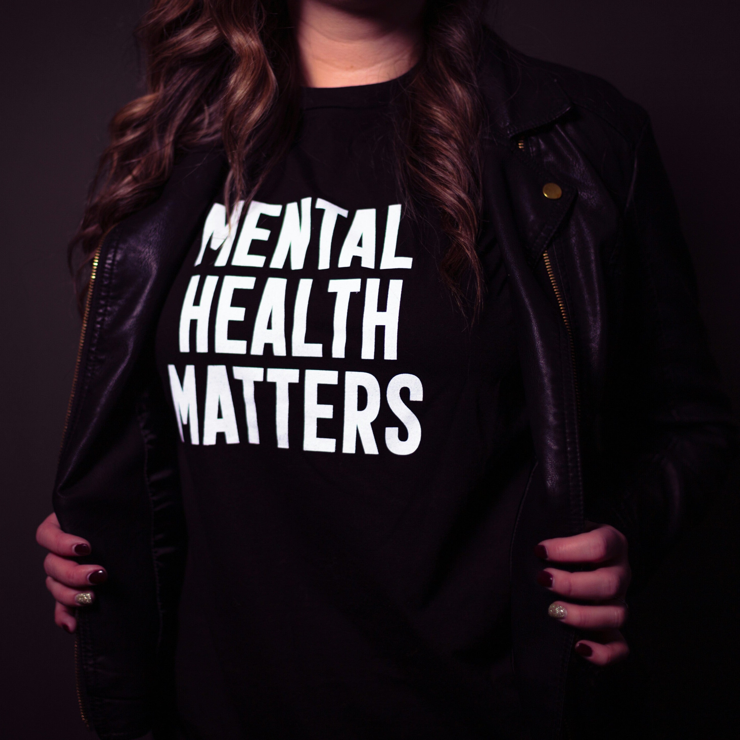 woman wearing black t-shirt with statement:  Mental Health Matters