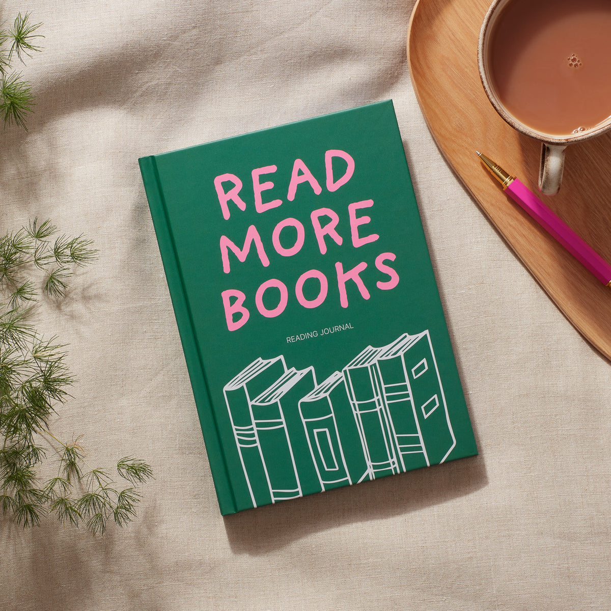 Reading Journal featuring &#39;Read More Books&#39; with colorful typography and stacked books design.