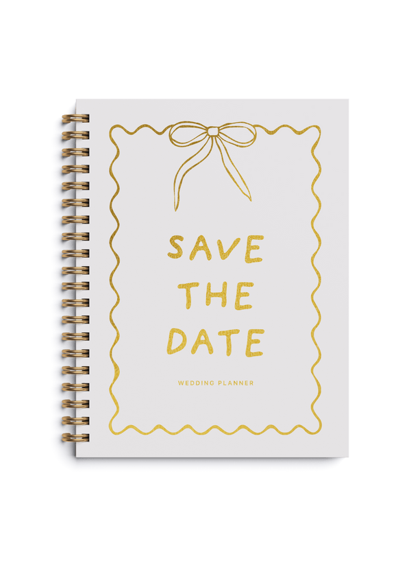 Wedding planner book with gold foiling and Save the Date design on a spiral cover.
