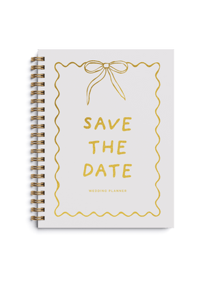 Wedding planner book with gold foiling and Save the Date design on a spiral cover.