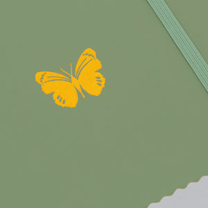sage green butterfly zoom on emblem