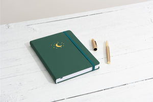 lined notebook on white table