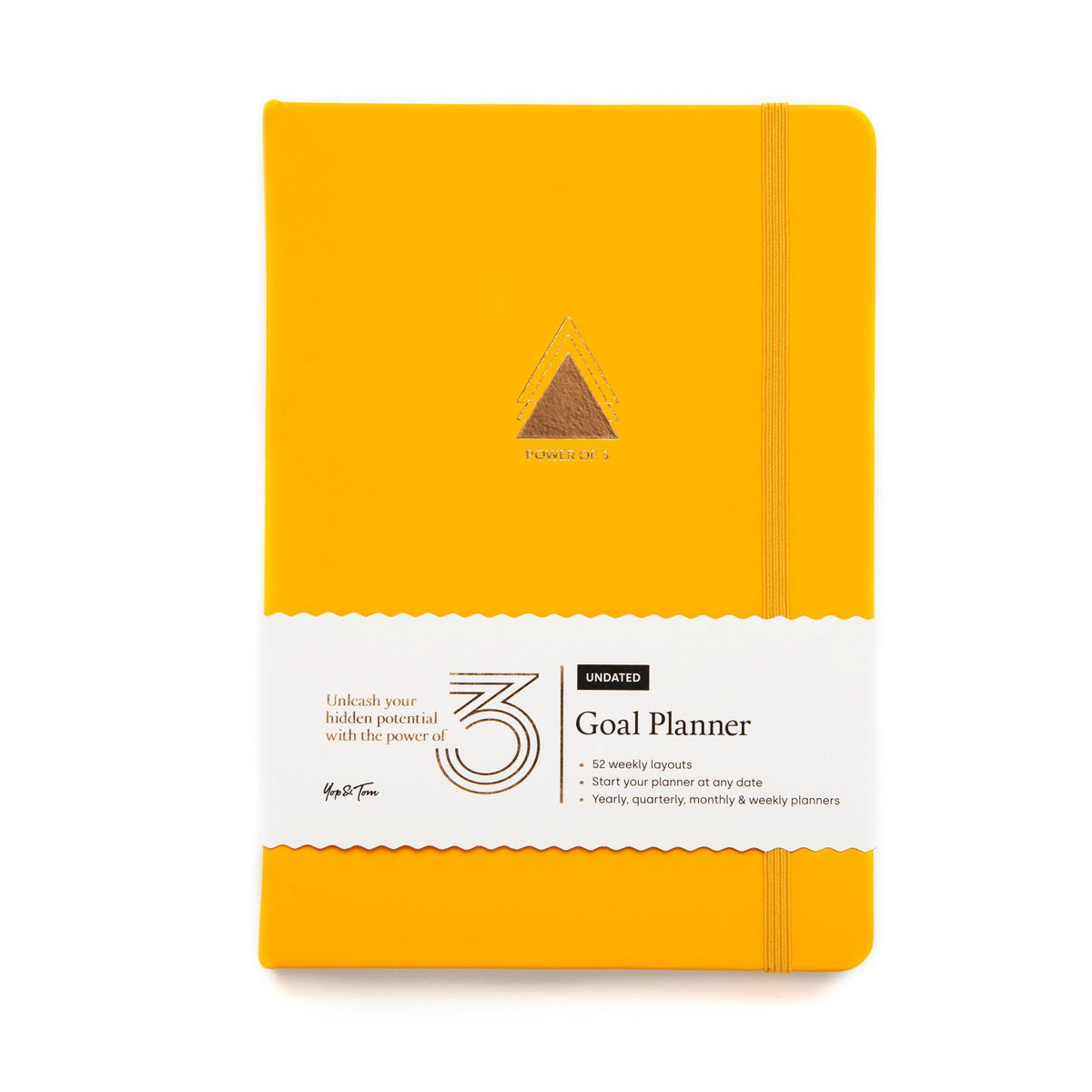 Front on shot of power of 3 goal planner in sunshine yellow showing gold triangle emblem and paper sleeve